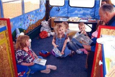 Kiwanis Club of Dawson Creek, B.C. 
Walter Schoen reading to the children on the WOW bus. 
February 29, 2009